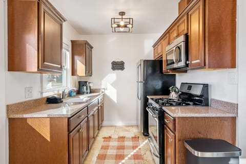 Full Kitchen With Gas Range and Stove