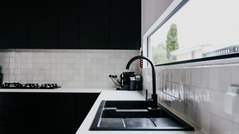 Fridge, stovetop, dishwasher, coffee/tea maker