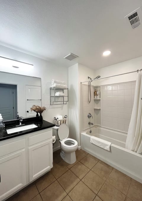 Combined shower/tub, hair dryer, towels, soap