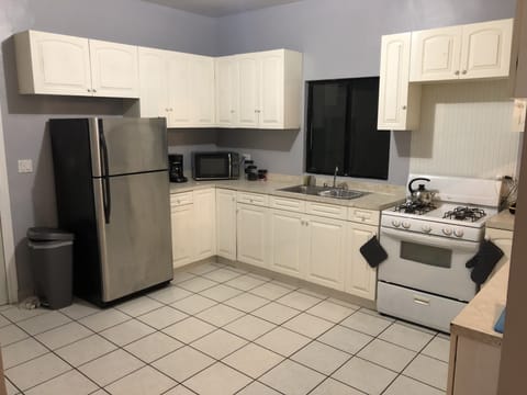 Fridge, microwave, cookware/dishes/utensils