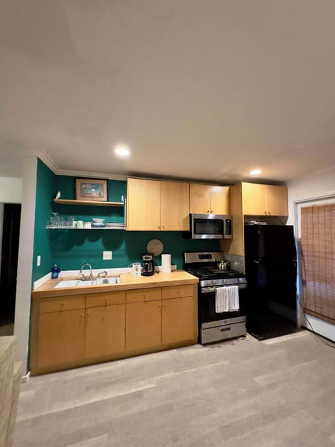 Full sized kitchen with full sized fridge