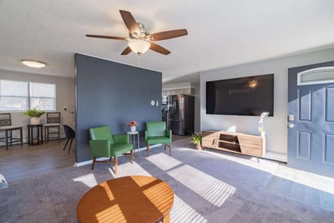 Living room with 70" Smart TV equipped with high speed internet.