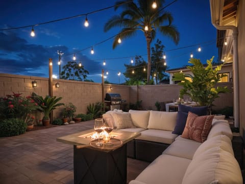 Relax under café lights by the fire table while you BBQ