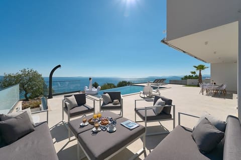 One of the many lounge spaces on the 150 m2 pool terraces overlooking the Adriatic sea and the Dalmatian archipelago. This particular lounge area for 10 is now shaded by a pergola.