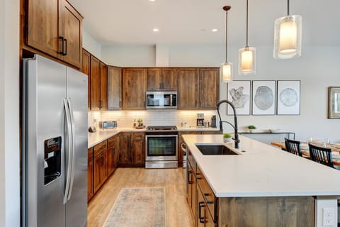 Gorgeous Fully Stocked Kitchen With Custom Wood Cabinetry Tying In That Warmth