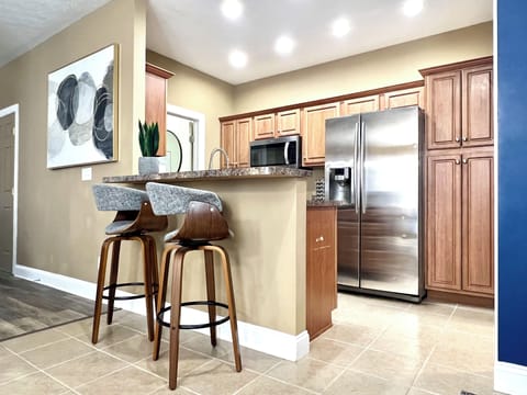 Full equipped kitchen with eat-in bar and stainless appliances!