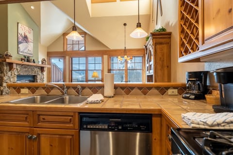 Full kitchen with stainless steel appliances.