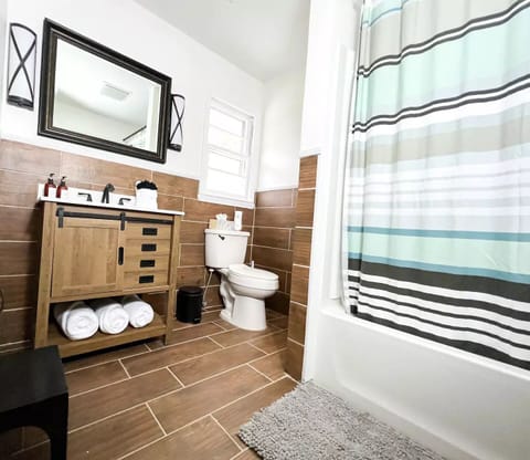 Combined shower/tub, hair dryer, towels, soap