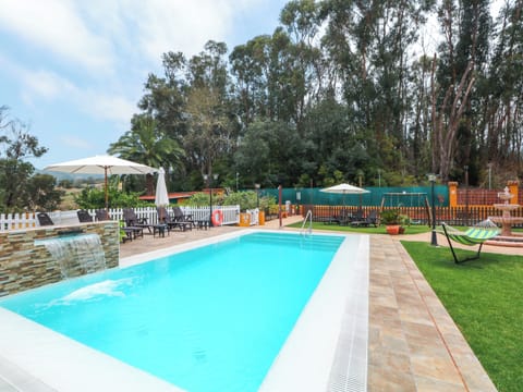 A heated pool, sun loungers