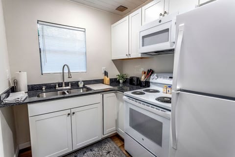 Fully equipped kitchen in studio home.