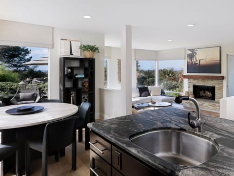 Open concept allows you to easily connect with guests from kitchen to living room and dining area