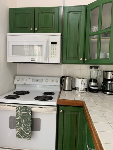 Fridge, stovetop, cookware/dishes/utensils, dining tables