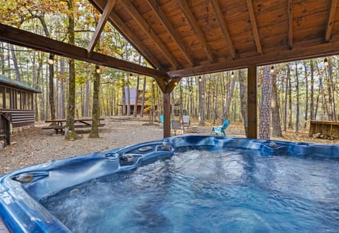 Enjoy a soothing soak in the hot tub, surrounded by nature and sheltered from the elements.