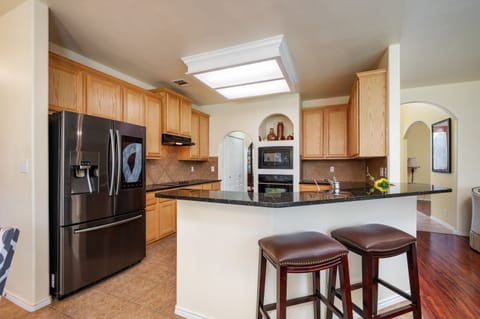 Check out our spacious and updated chef kitchen! Its features plenty of space and all the amenities you need to cook a meal for the entire group.