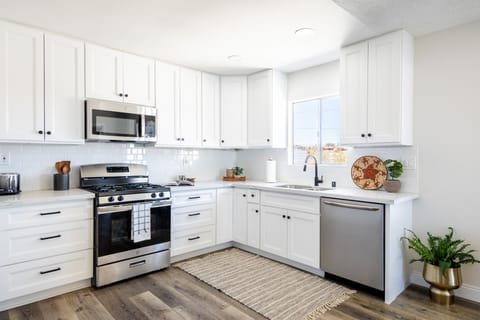 Modern kitchen with natural flowing light of the backyard