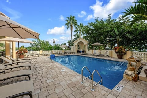 A heated pool, sun loungers