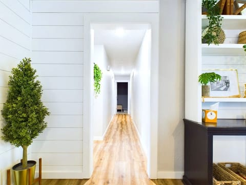 One hallway, endless charm—leading you to cozy corners.