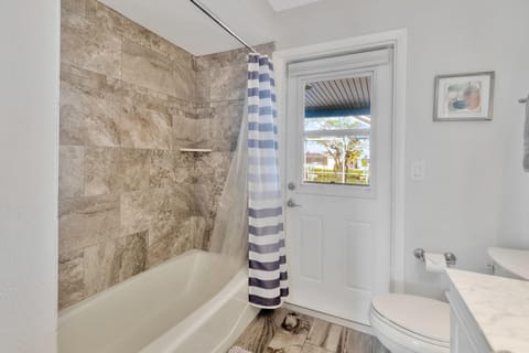 Combined shower/tub, hair dryer