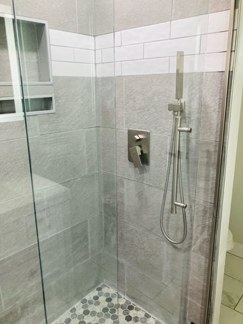 Combined shower/tub, hair dryer, towels, soap