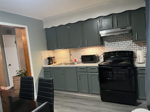 Full kitchen w/ refrigerator, stove, table & chairs for 6 and washer and dryer.