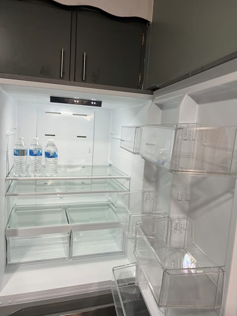Refrigerator stocked with limited water bottles