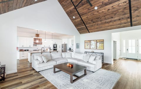 Stay connected with your loved ones in this open-concept family room. Enjoy easy access to the kitchen and all the bedrooms, making it the perfect gathering space for your group.