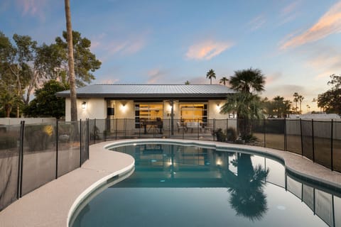 A heated pool, sun loungers