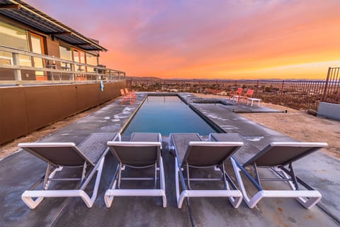 Desert Oasis: Luxuriate in a 10x30 pool where the water meets the sky at sunset, inviting endless evenings of serenity.