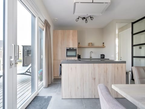 Fridge, stovetop, dishwasher, coffee/tea maker