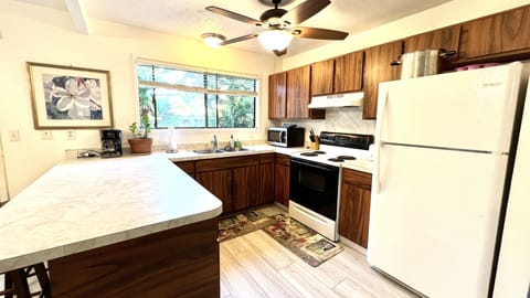 Full kitchen with oven and full size fridge