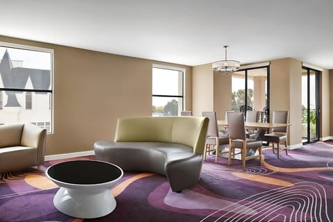 Lounge comfortably in a sunlit space with stylish seating.