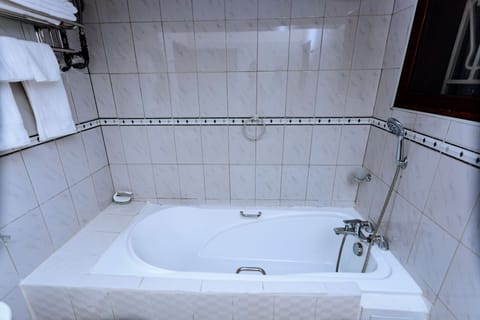 Combined shower/tub, hair dryer, towels, soap