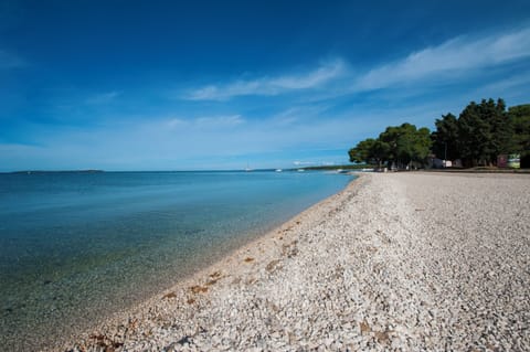 On the beach, sun loungers