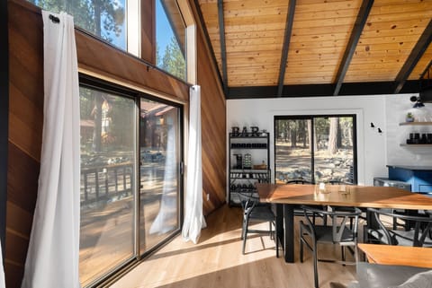 Large dining room with seating for 6, and coffee bar.