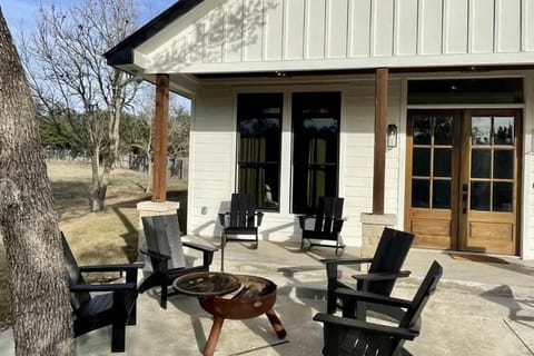 Relax and unwind around the fire pit in this peaceful outdoor seating area.