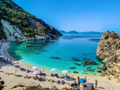 On the beach, sun loungers, beach towels