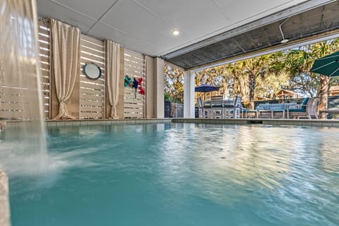 A heated pool, a waterfall pool, sun loungers