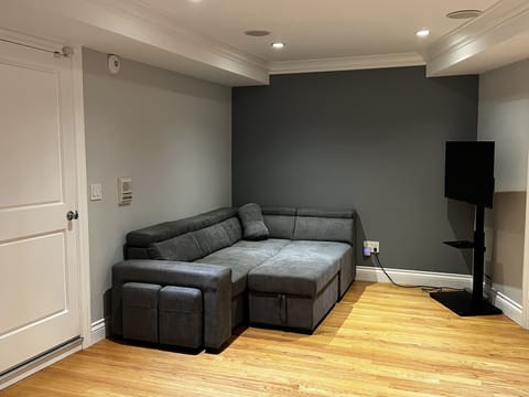 Pullout sofa with adjustable headrests, ottoman, two pullout benches for kids