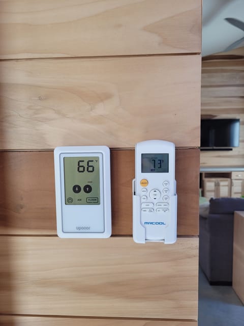 Thermostat (left) and AC/heat remote control (right)