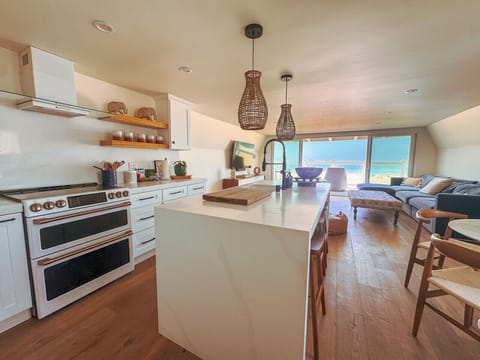Coastal escape with ocean views! Enjoy a modern space with a full kitchen, comfy living area, and direct beach access