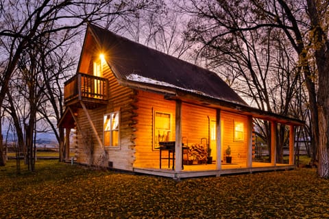 Two story log cabin.