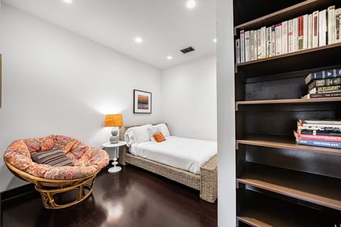 Second floor bedroom with queen bed + papasan chair
