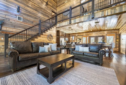 At Daydream Believer, an open concept living area is the central feature, with a cozy gas fireplace and plenty of seating.