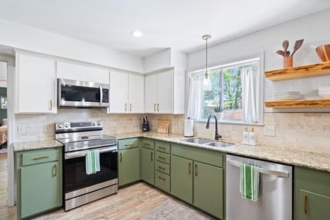Fully stocked kitchen with stainless appliances