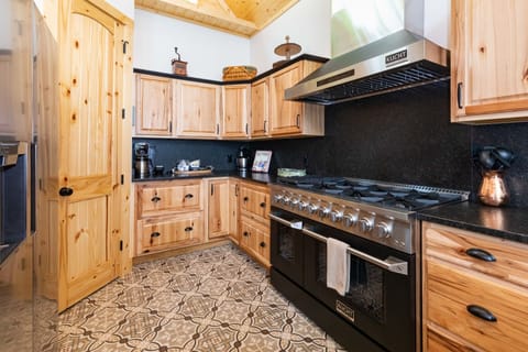 The chef's kitchen boasts an double ovens for your cooking pleasure.