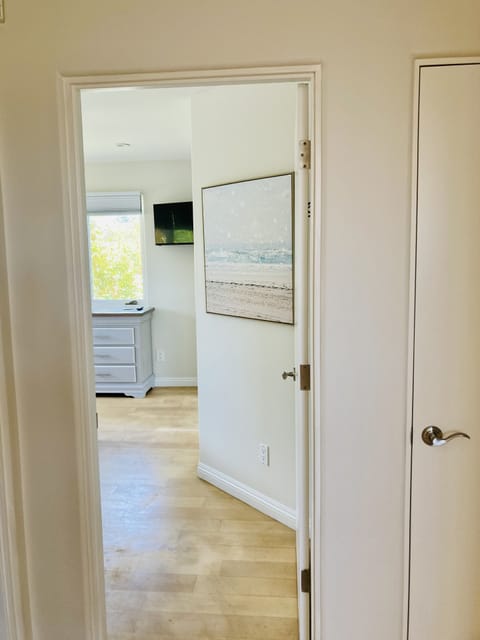 Straight ahead is the 2nd bedroom and right to the left in the 2nd full bathroom