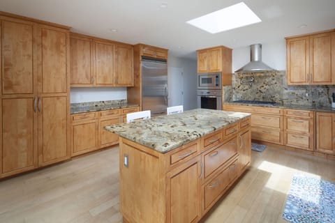 Clean kitchen area stocked with all your essentials and lots of storage