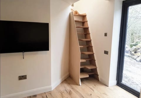 Please note: The downstairs living room is accessed via paddle steps