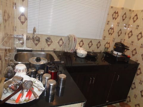 Fridge, coffee/tea maker, electric kettle, cookware/dishes/utensils