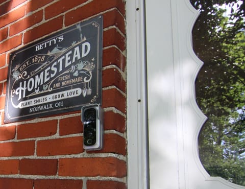 Entrance to the house. Smart lock door code panel on inside door